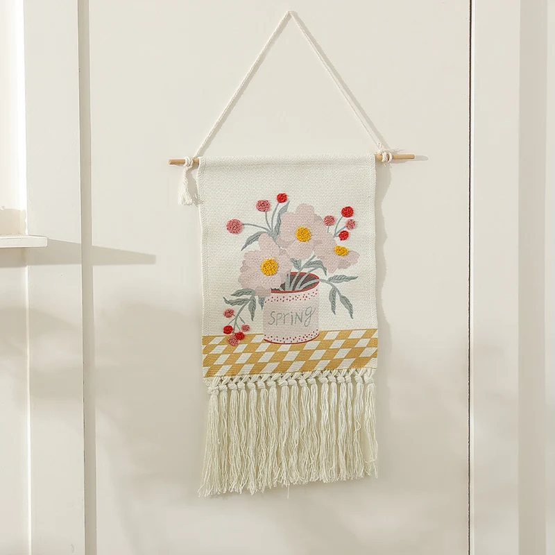 Woven cotton wall hanging with punch needle flower relief and fringes Stornfield