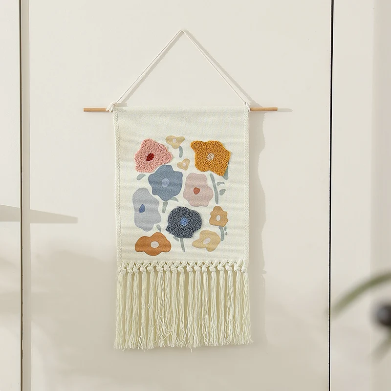Woven cotton wall hanging with punch needle flower relief and fringes Stornfield