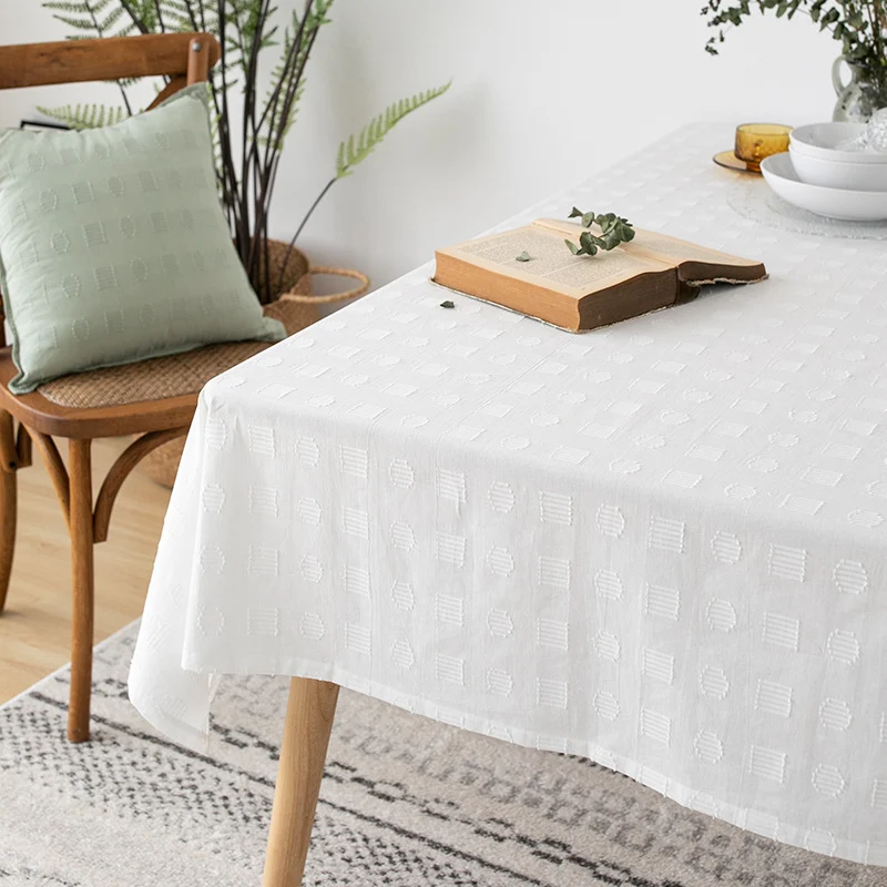 Tablecloth made of cotton blend with embossed square and circle relief Stornfield