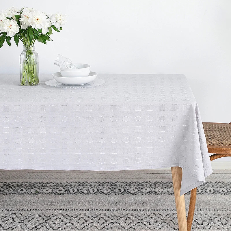 Tablecloth made of cotton blend with embossed square and circle relief Stornfield