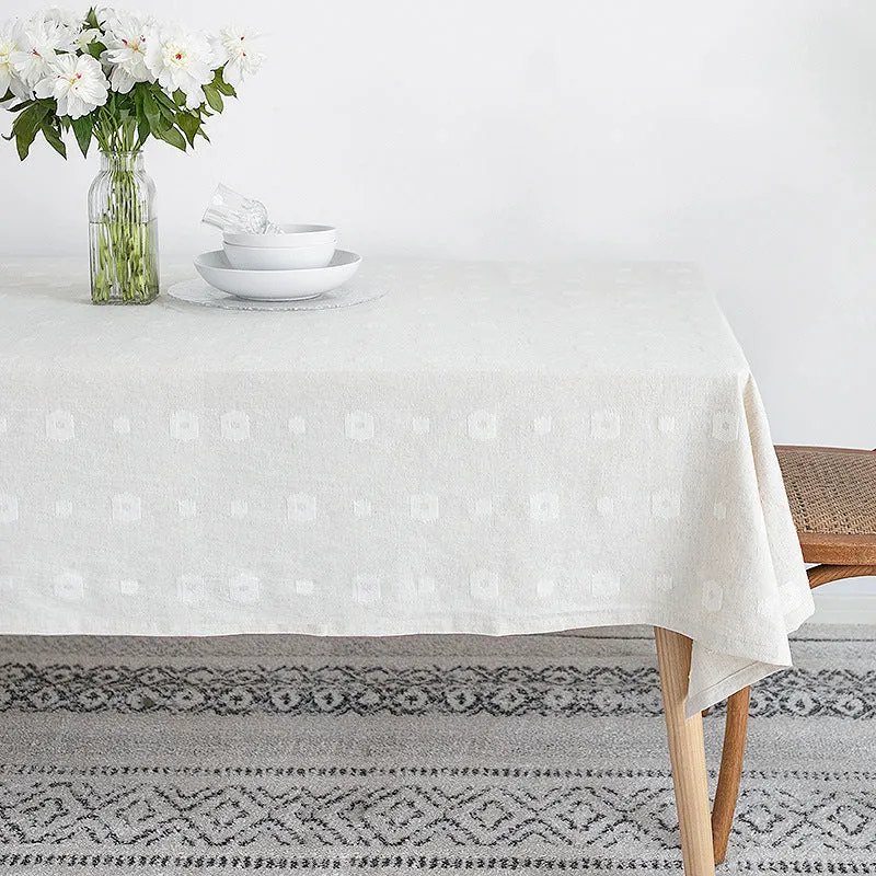 Tablecloth made of cotton blend with embossed square and circle relief Stornfield