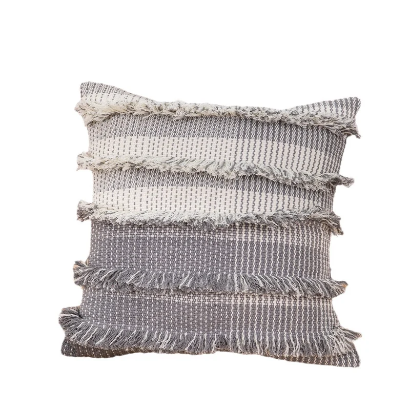 Structured decorative cushion cover with layered fringes and two-tone woven pattern Stornfield