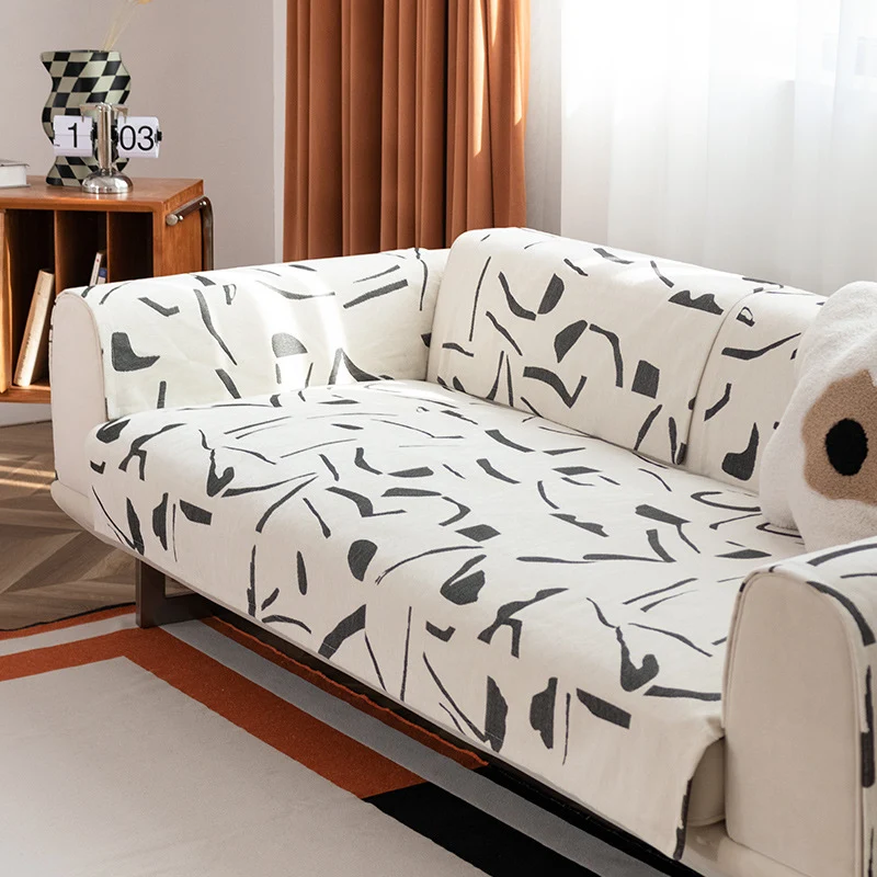 Stretch sofa cover with abstract brushstroke print and elastic waistband Stornfield