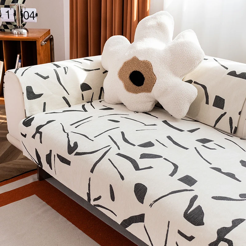 Stretch sofa cover with abstract brushstroke print and elastic waistband Stornfield