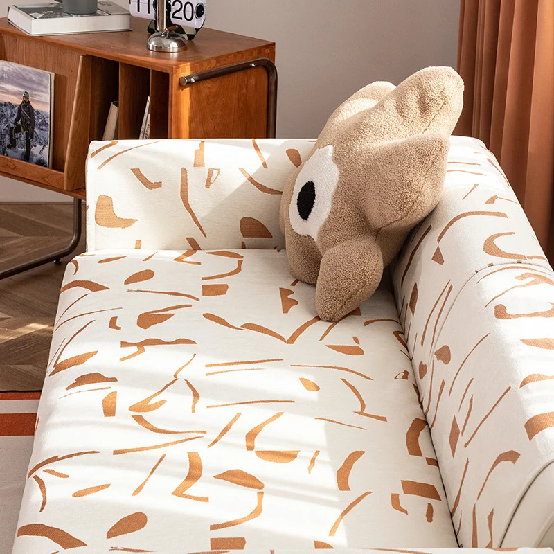 Stretch sofa cover with abstract brushstroke print and elastic waistband Stornfield
