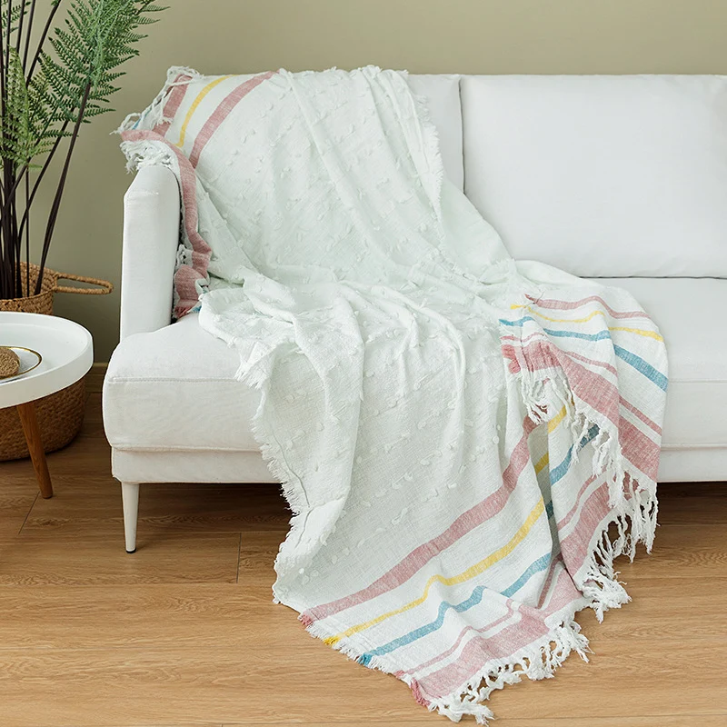 Light striped cotton throw blanket with fringes and textured knot appliqué Stornfield