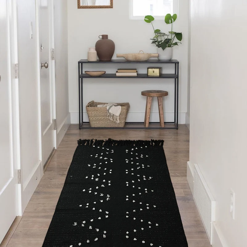 handwoven living room rug with fringes and geometric perforated pattern Stornfield