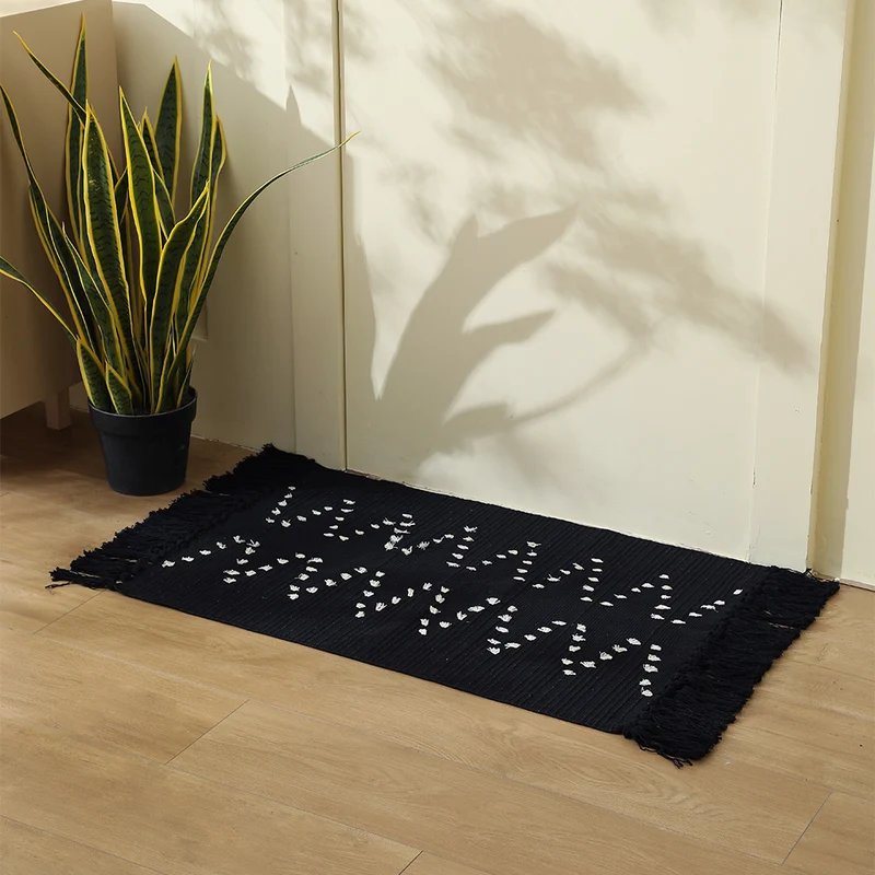 handwoven living room rug with fringes and geometric perforated pattern Stornfield