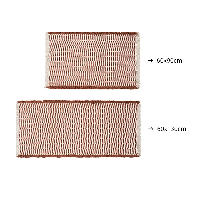 Handwoven cotton bath mat with herringbone pattern and fringes Stornfield
