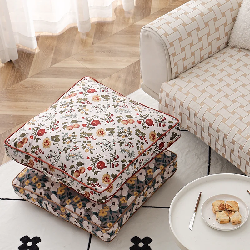 Large square floor cushion with floral cotton cover, piping, and carrying handle Stornfield