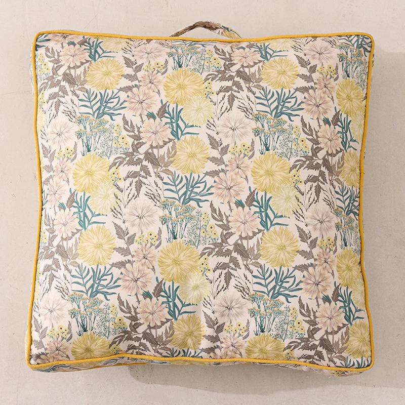 Large square floor cushion with floral cotton cover, piping, and carrying handle Stornfield