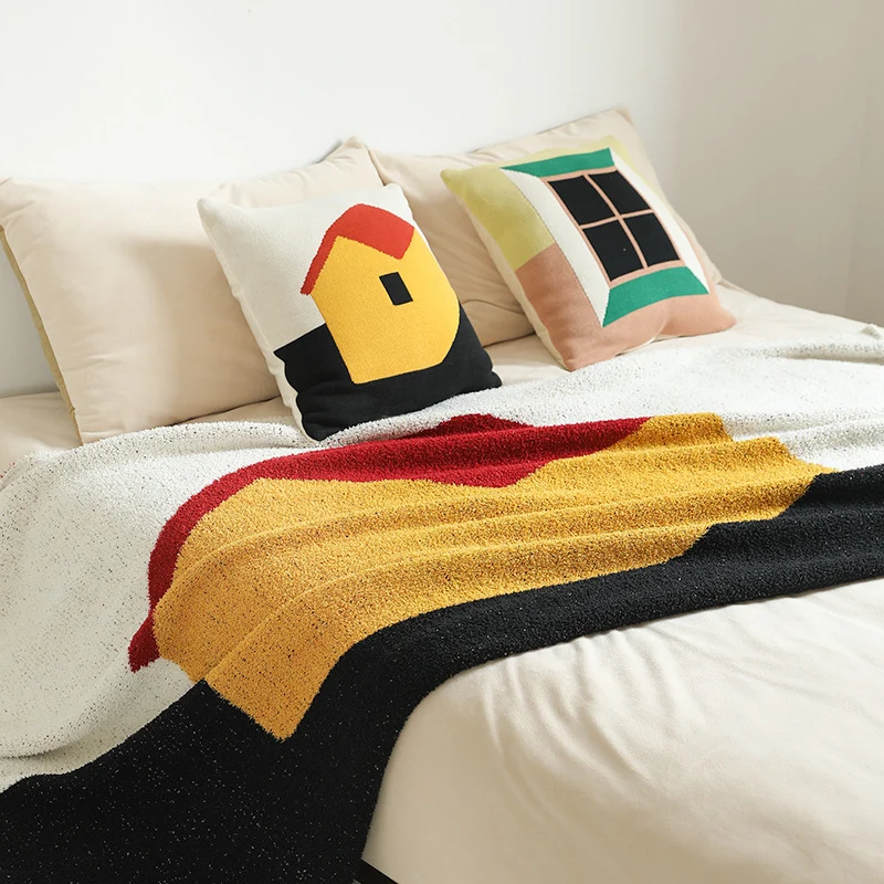 Coarsely woven decorative blanket with geometric jacquard pattern and soft bouclé Stornfield
