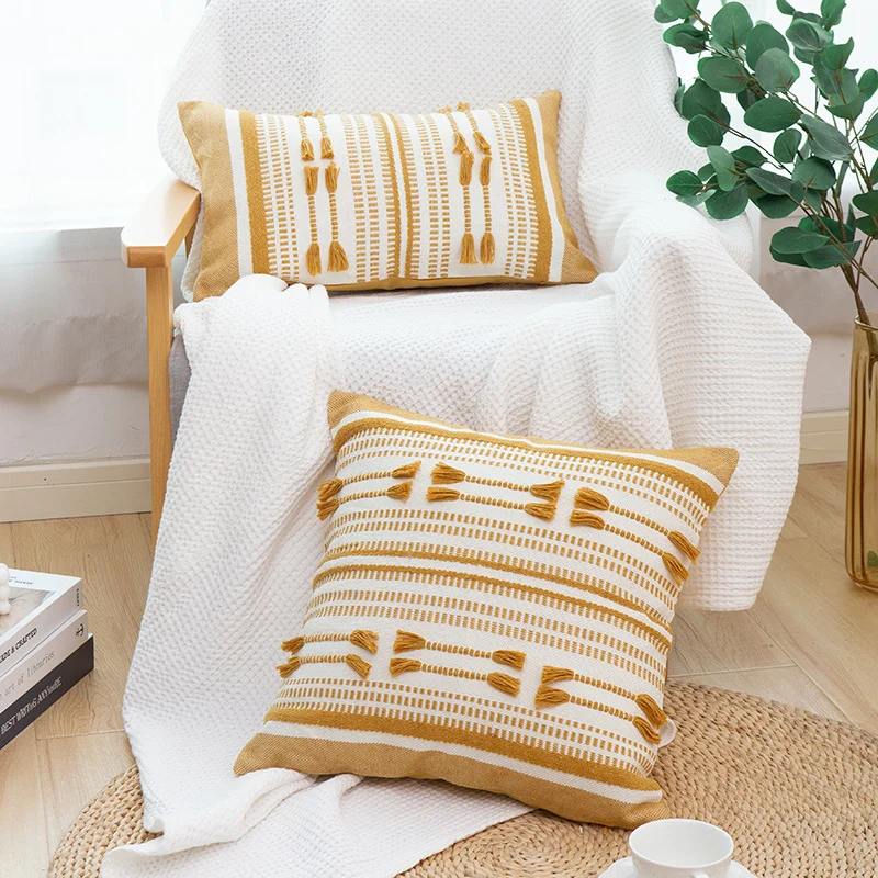 Woven decorative cushion cover with ordered tassel application and structured jacquard weaving Stornfield