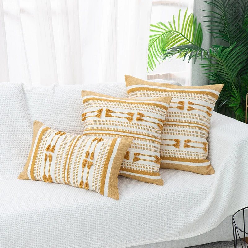 Woven decorative cushion cover with ordered tassel application and structured jacquard weaving Stornfield