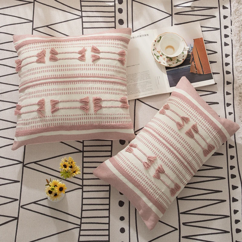 Woven decorative cushion cover with ordered tassel application and structured jacquard weaving Stornfield