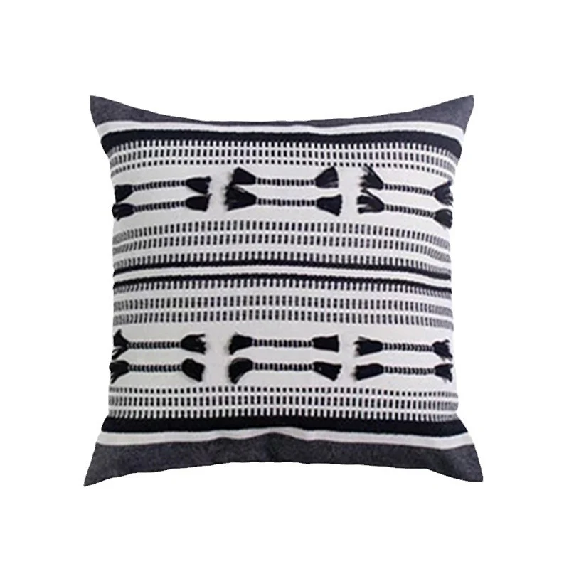 Woven decorative cushion cover with ordered tassel application and structured jacquard weaving Stornfield