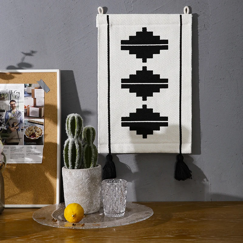 Woven wall hanging with graphic ethnic relief and tassels Stornfield
