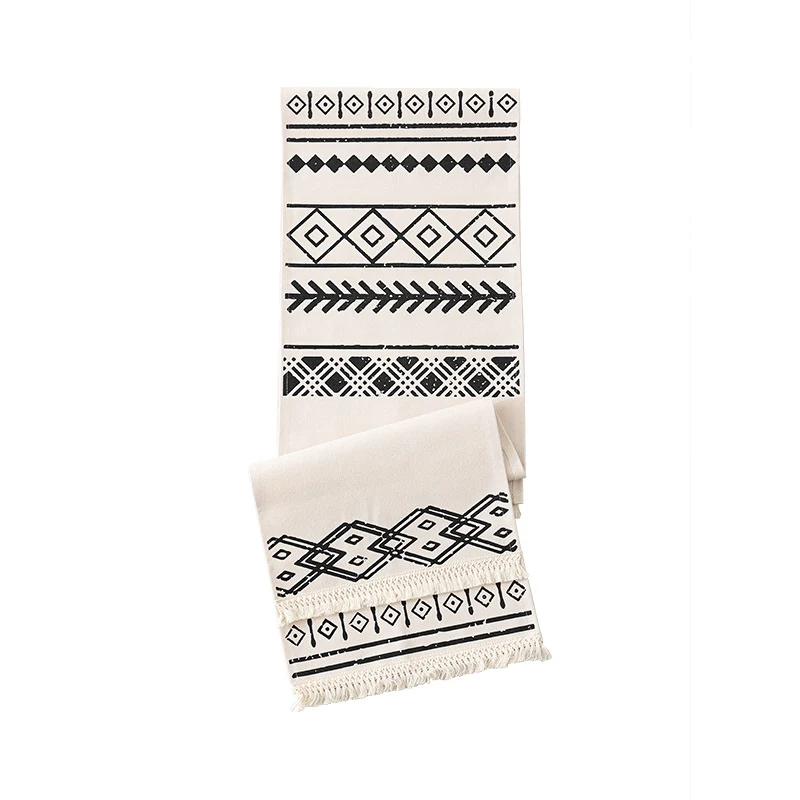 Woven table runner in Boho style with fringes and geometric ethnic print Stornfield