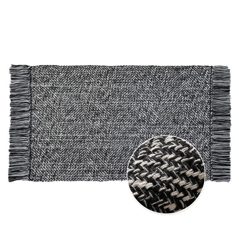 Woven table runner made of cotton blend with fine structure and herringbone look as well as decorative fringes Stornfield