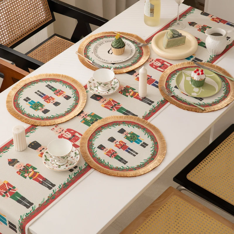 Festive woven table runner with nutcracker motif and golden fringes Stornfield