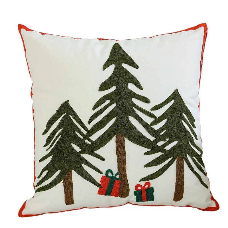 Decorative cushion cover with festive Christmas star print and pom-pom trim Stornfield