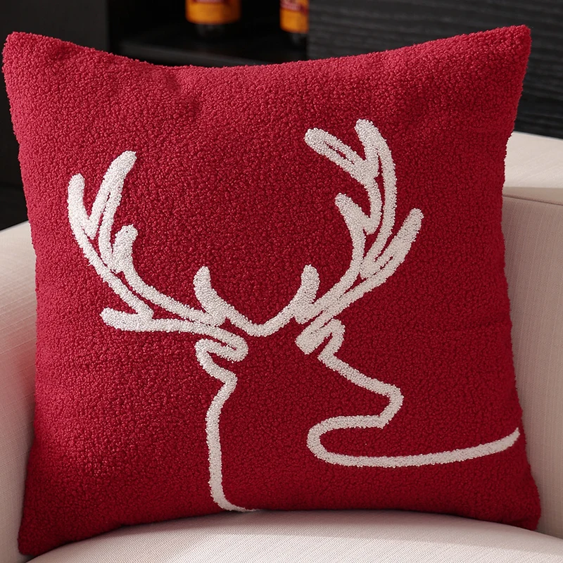 Decorative cushion cover with festive Christmas star print and pom-pom trim Stornfield