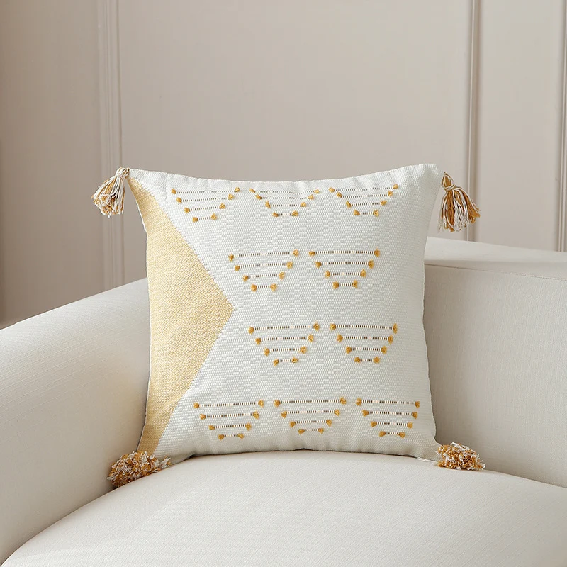 Decorative woven cushion cover with geometric tuft-relief and tassels Stornfield