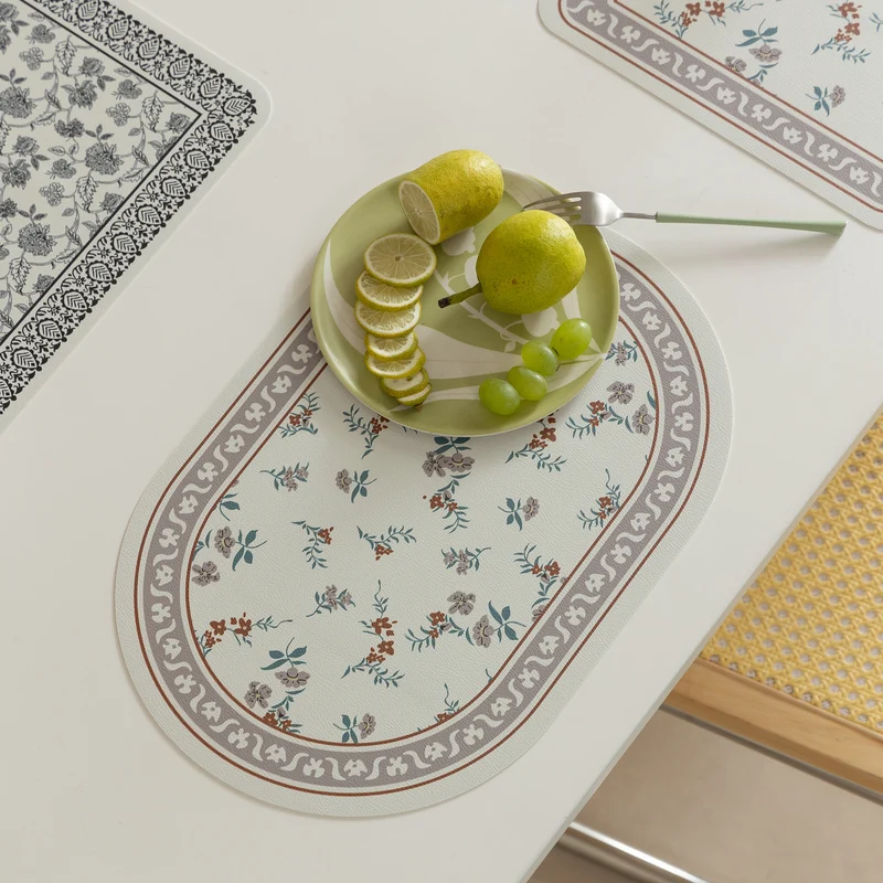 Wipeable table mats made of PU leather with botanical silhouette design Stornfield