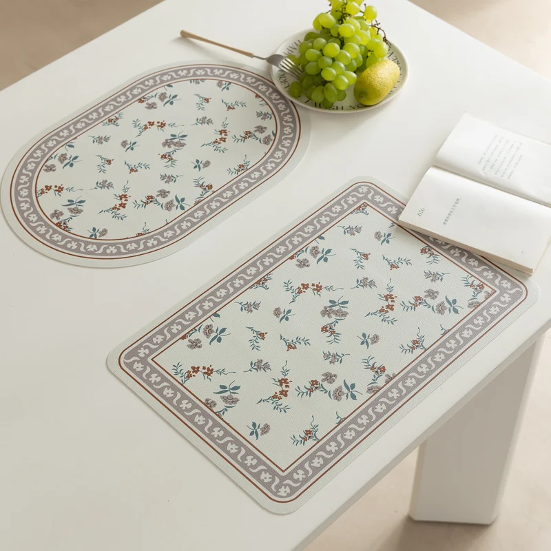 Wipeable table mats made of PU leather with botanical silhouette design Stornfield