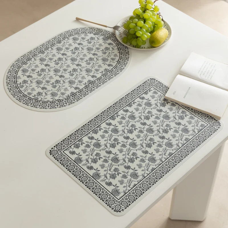 Wipeable table mats made of PU leather with botanical silhouette design Stornfield