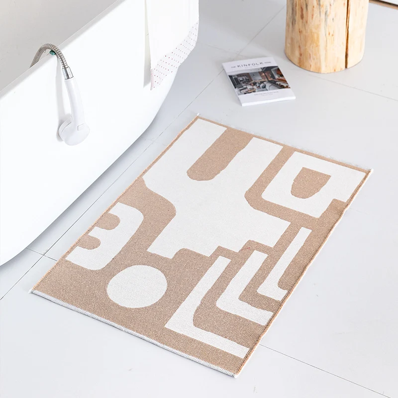 Flat-woven bath mat with abstract geometric pattern Stornfield
