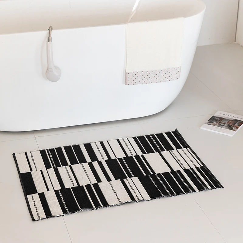 Flat-woven bath mat with abstract geometric pattern Stornfield