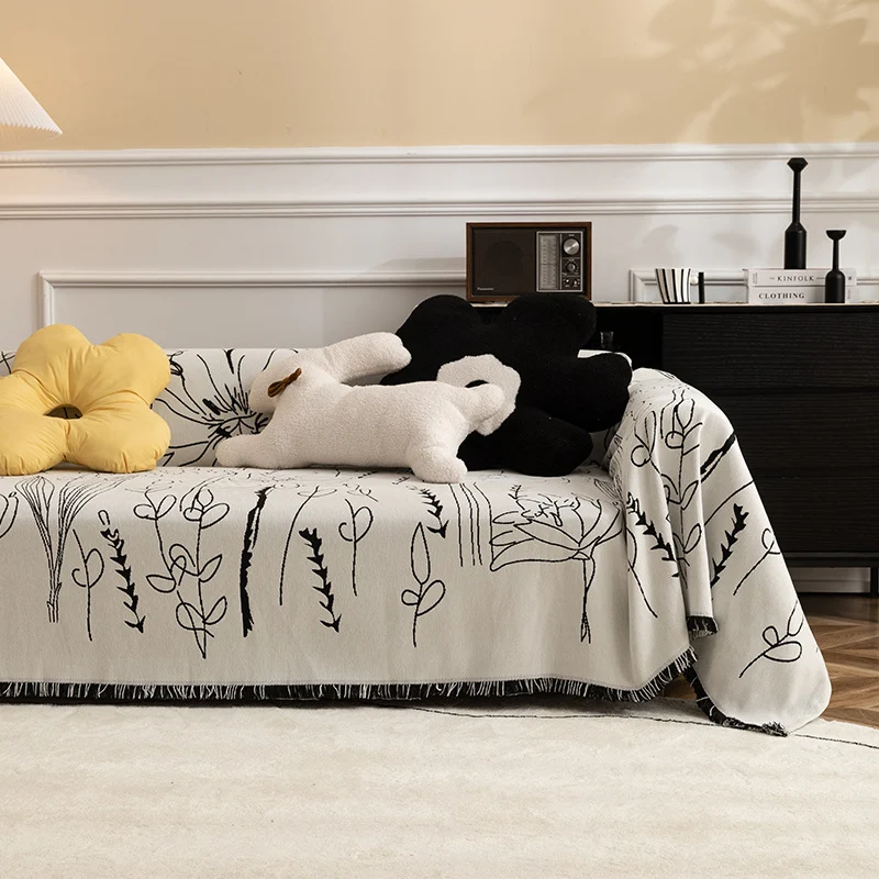 Fine woven sofa cover and furniture throw with floral line drawing and decorative fringed edge Stornfield