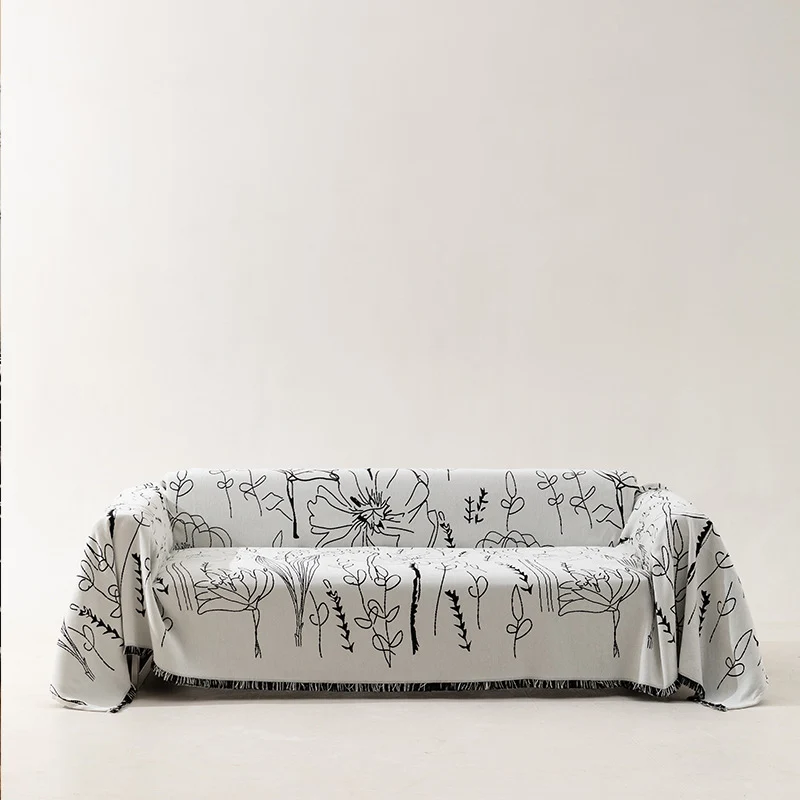 Fine woven sofa cover and furniture throw with floral line drawing and decorative fringed edge Stornfield