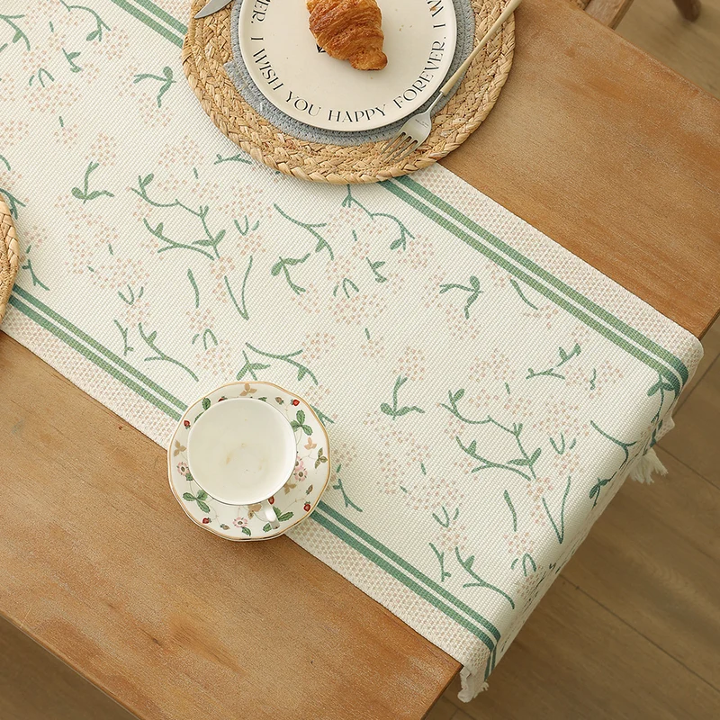 decorative table runner made of woven cotton with tassels Stornfield