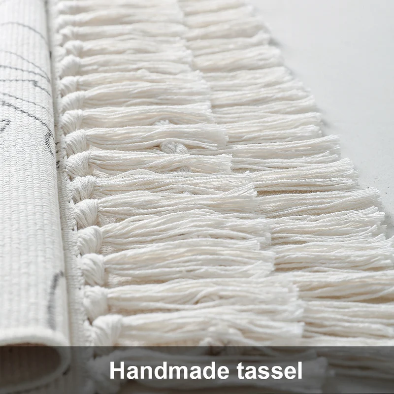 Decorative table runner made of cotton with botanical bird print and fringes Stornfield