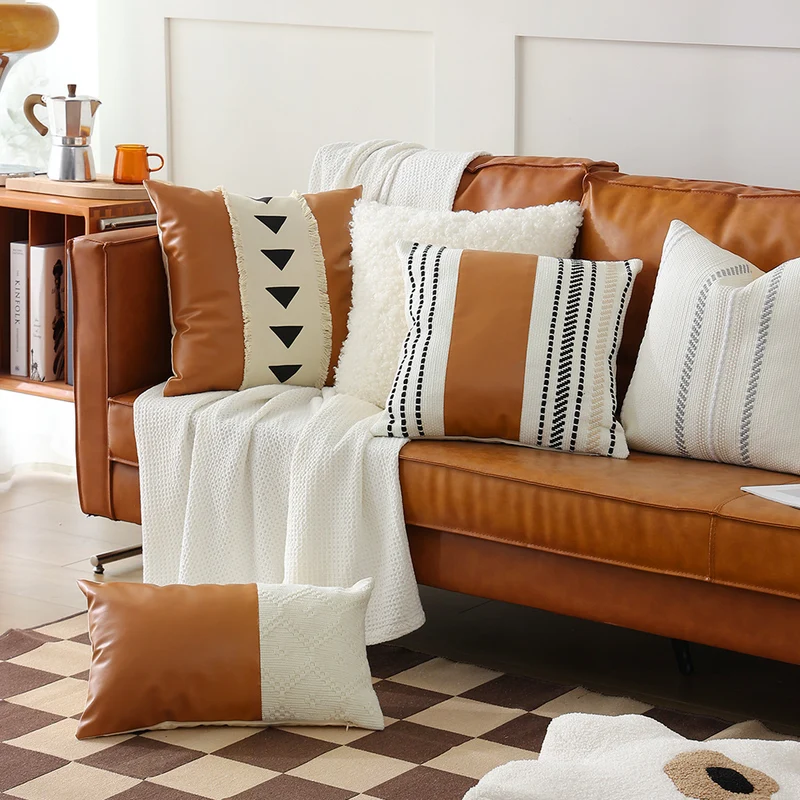 Decorative cushion cover made of faux leather with woven ethnic stripe Stornfield