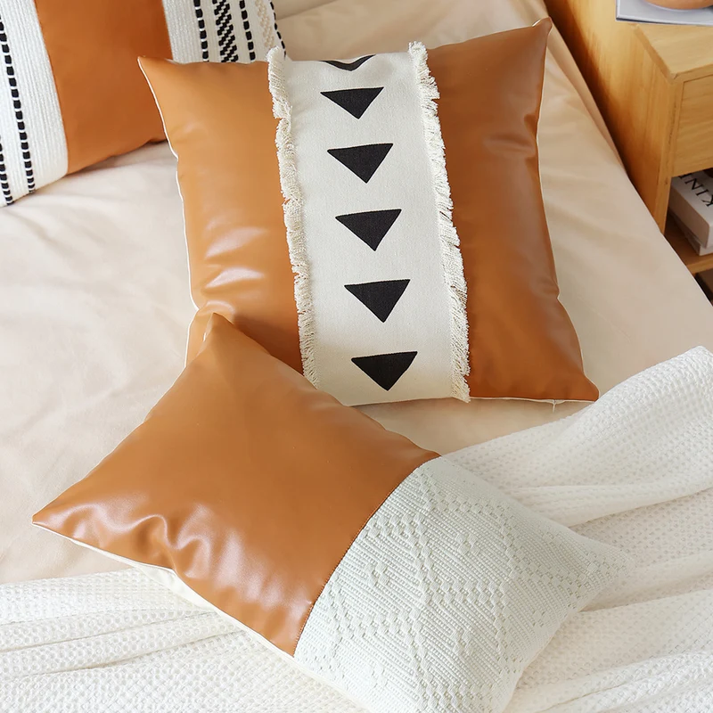 Decorative cushion cover made of faux leather with woven ethnic stripe Stornfield