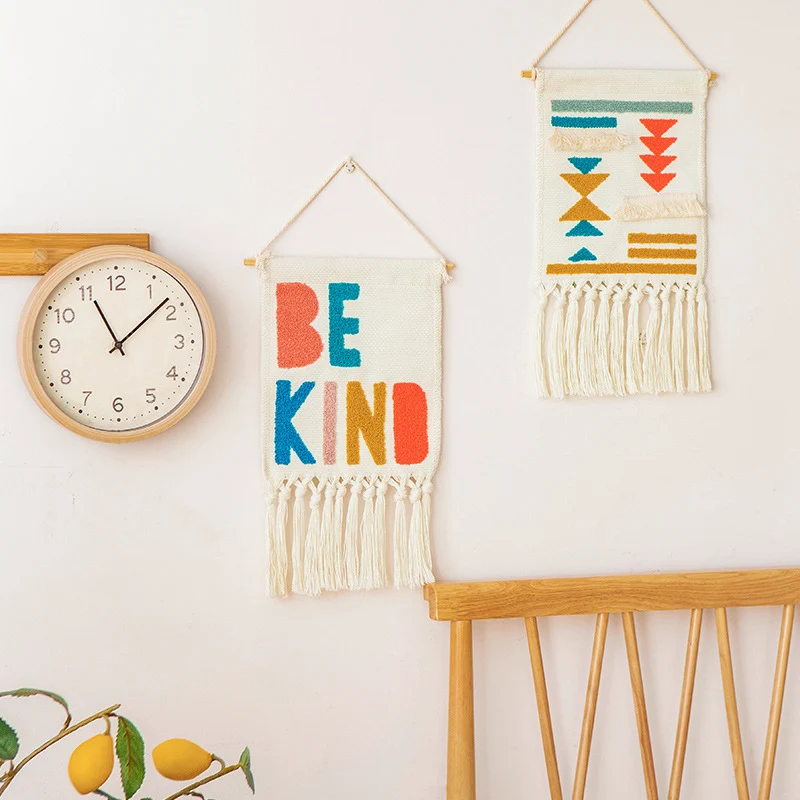 Boho wall hanging made of woven cotton with hand-tufted appliqués and fringes Stornfield