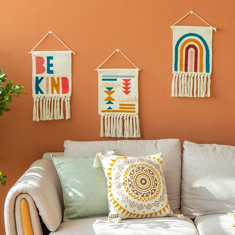 Boho wall hanging made of woven cotton with hand-tufted appliqués and fringes Stornfield