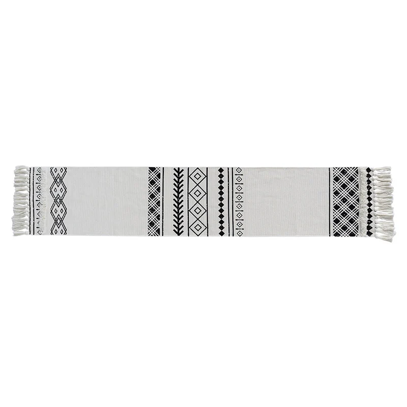 Boho table runner made of cotton blend with woven ethnic jacquard and decorative fringes Stornfield