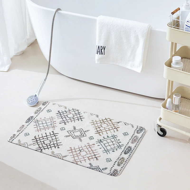 Boho cotton bath mat with fringes and geometric diamond pattern Stornfield