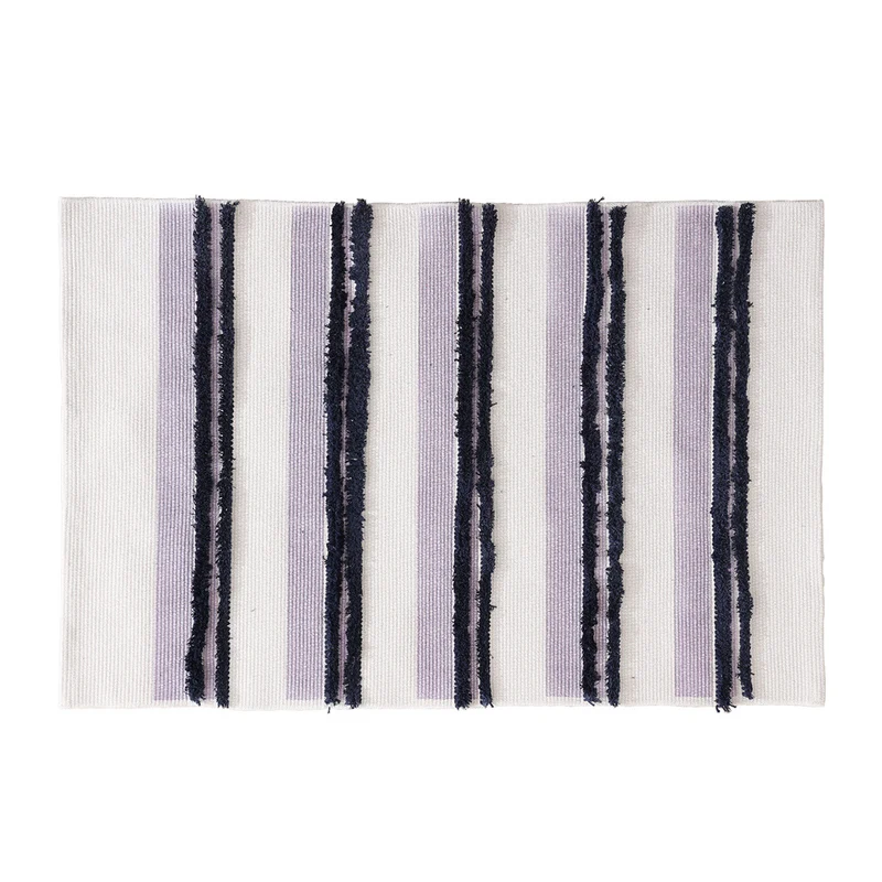Cotton bath mat with textured stripes and fringes Stornfield