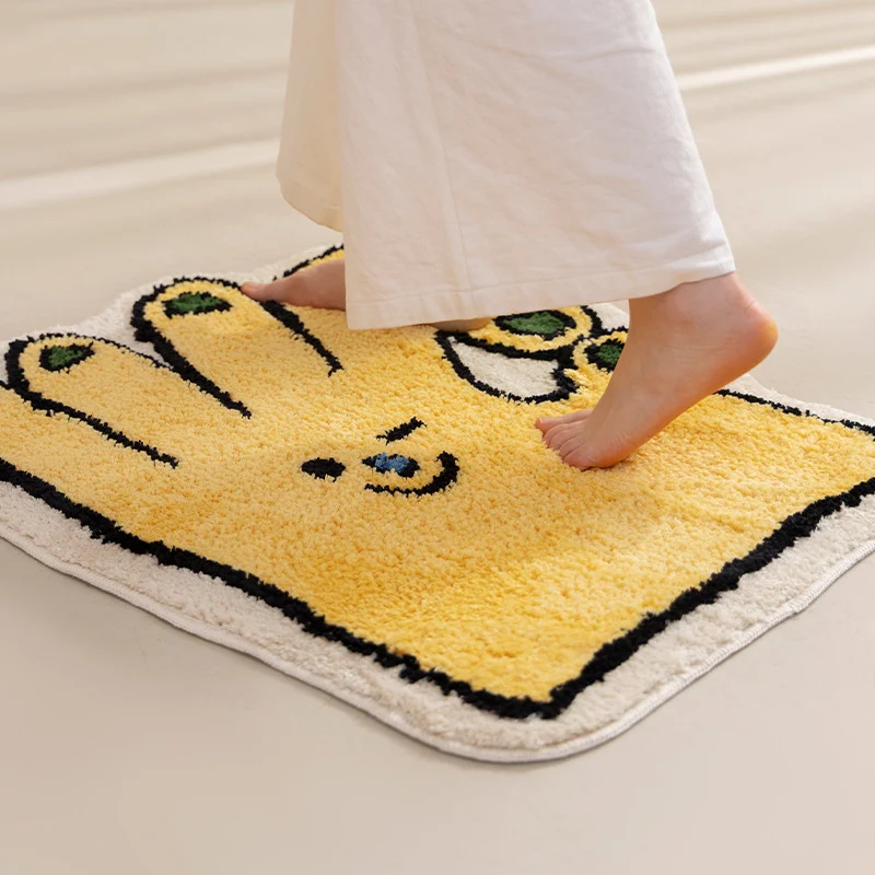 Funny hand-shaped bath mat made of non-slip microfiber plush Stornfield