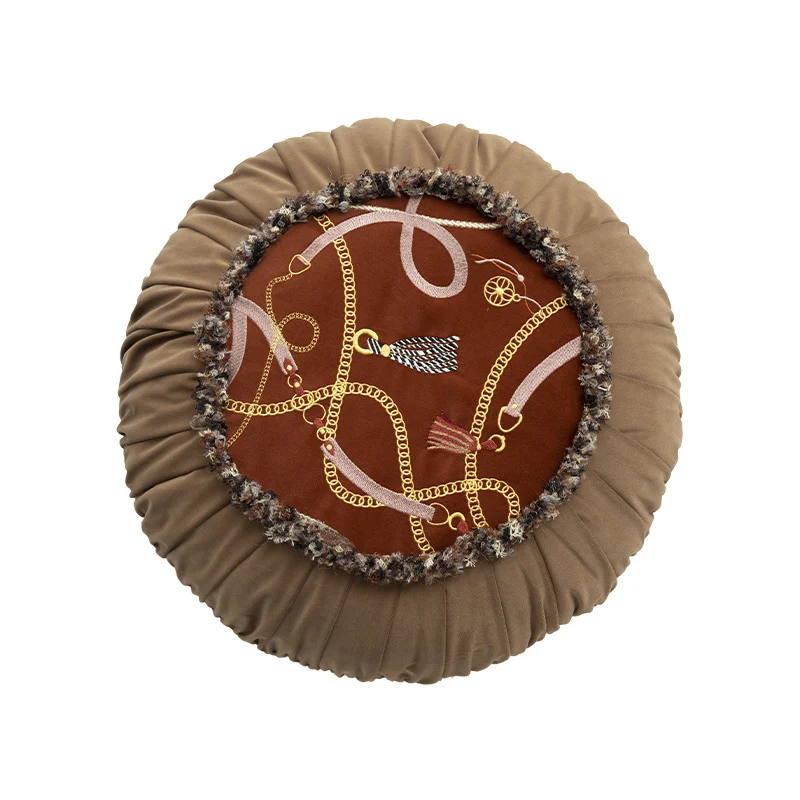 Round decorative pillow with pleated edge, fringe trim, and chain tassel motif Stornfield