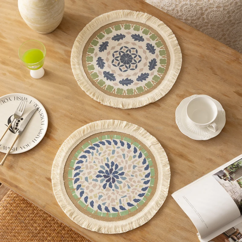 Round handmade woven decorative rug with fringes and botanical pattern Stornfield