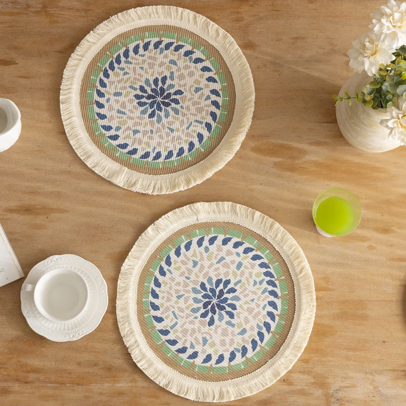 Round handmade woven decorative rug with fringes and botanical pattern Stornfield