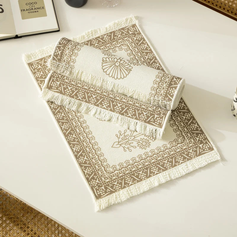 Round handmade woven decorative rug with fringes and botanical pattern Stornfield
