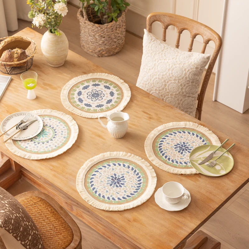 Round handmade woven decorative rug with fringes and botanical pattern Stornfield