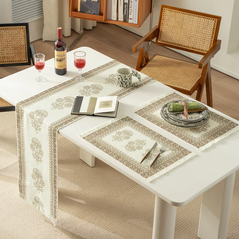 Round handmade woven decorative rug with fringes and botanical pattern Stornfield
